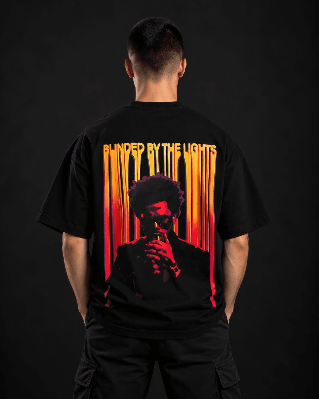 The Weeknd oversized t-shirt in black, back view with Blinded by the Lights portrait graphic