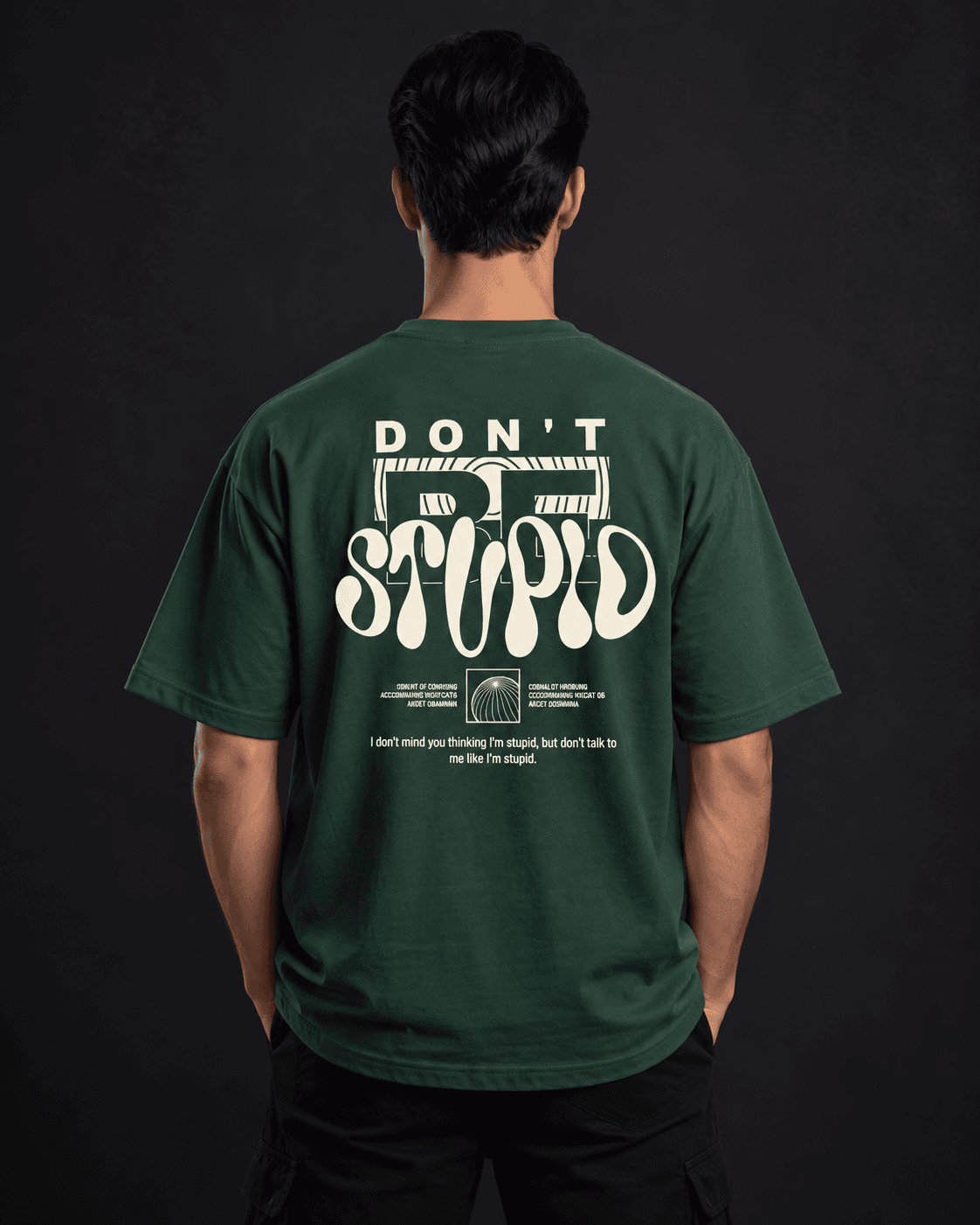 Don't Be Stupid oversized graphic t-shirt back view in bottle green