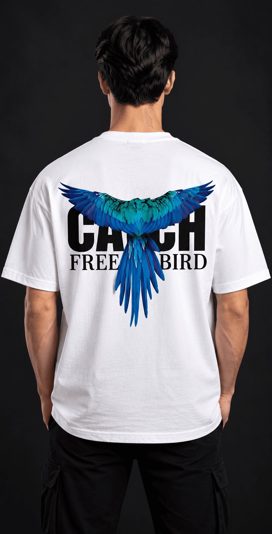 Catch Free Bird oversized graphic t-shirt back view with blue macaw print